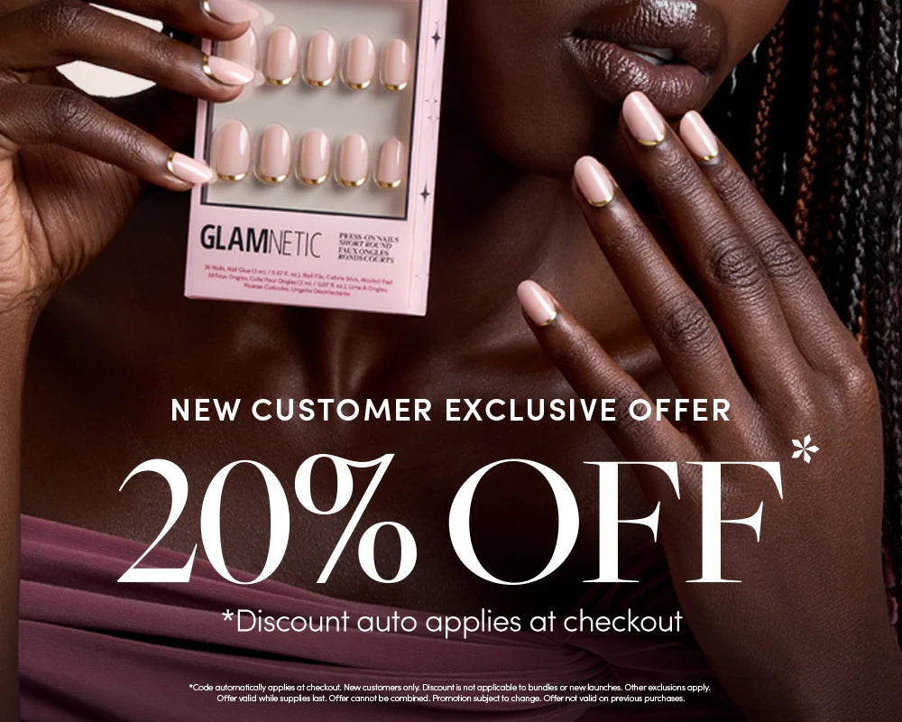 A person holds a set of Glaminetic press-on nails near their face and hand, showcasing nude and pink nails. Text reads New customer exclusive offer: 20% off. Discount auto applies at checkout.