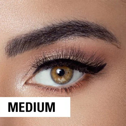 A close-up of a brown eye with long lashes, winged eyeliner, and groomed eyebrows. The word MEDIUM appears in bold text at the bottom left.