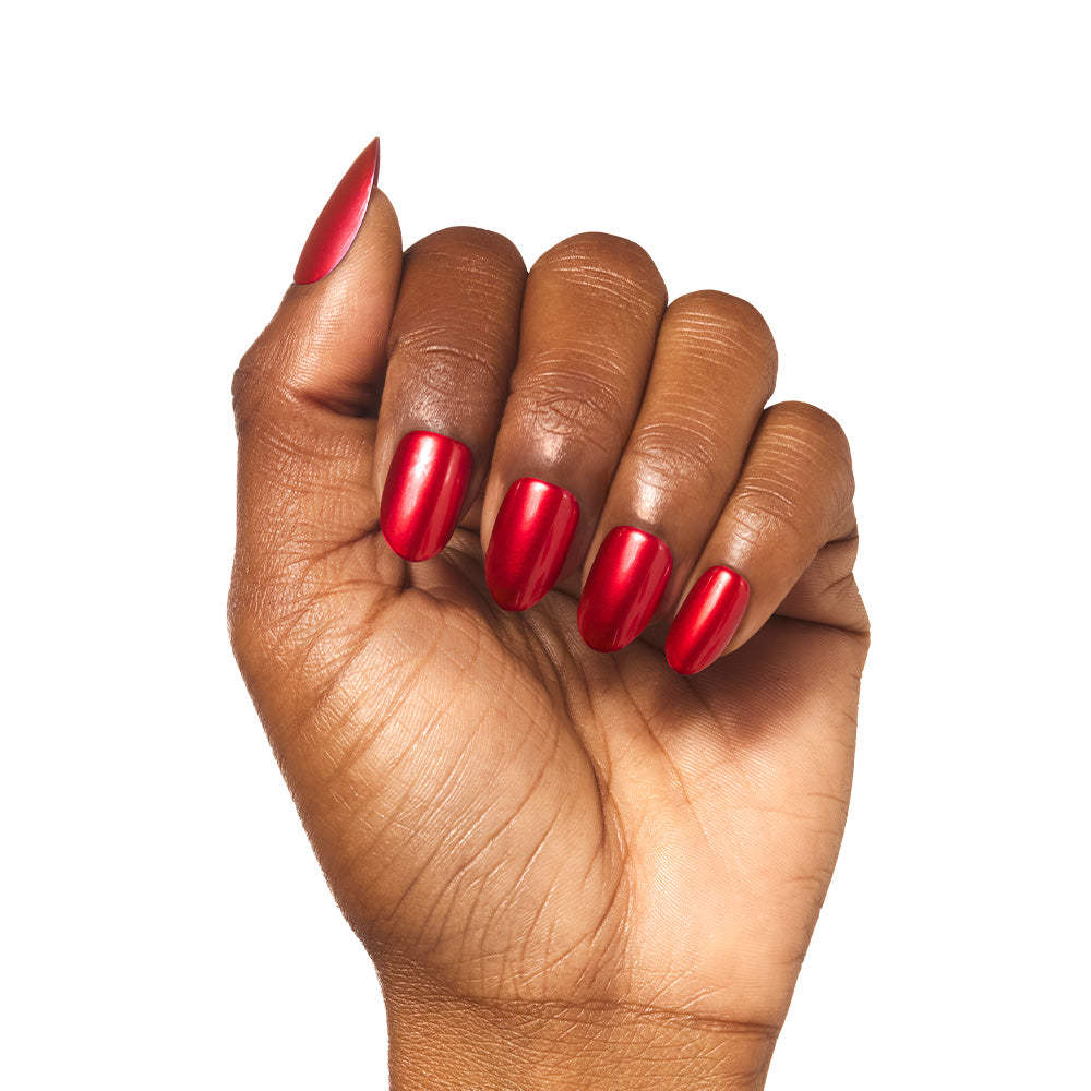 A hand with medium brown skin shows off neatly manicured, short round nails painted in glamnetic’s Cherry Glaze, a glossy cherry-red shade, against a white background. - Product image