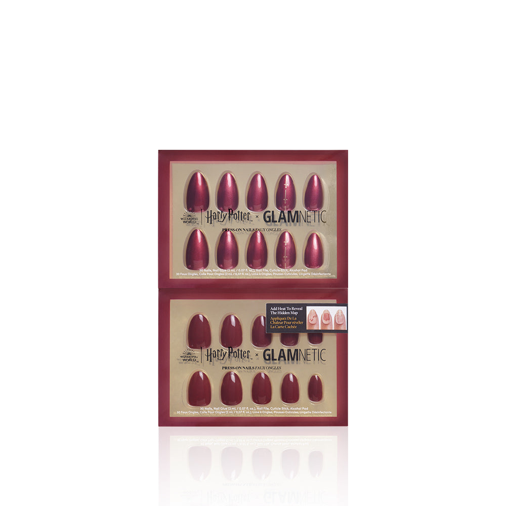 Two sets of glamnetic Team Gryffindor™ press-on nails in deep red, inspired by Gryffindor, come in gold Harry Potter x glamnetic packaging. Each vegan, cruelty-free set includes various nail sizes and a small image showing them worn.