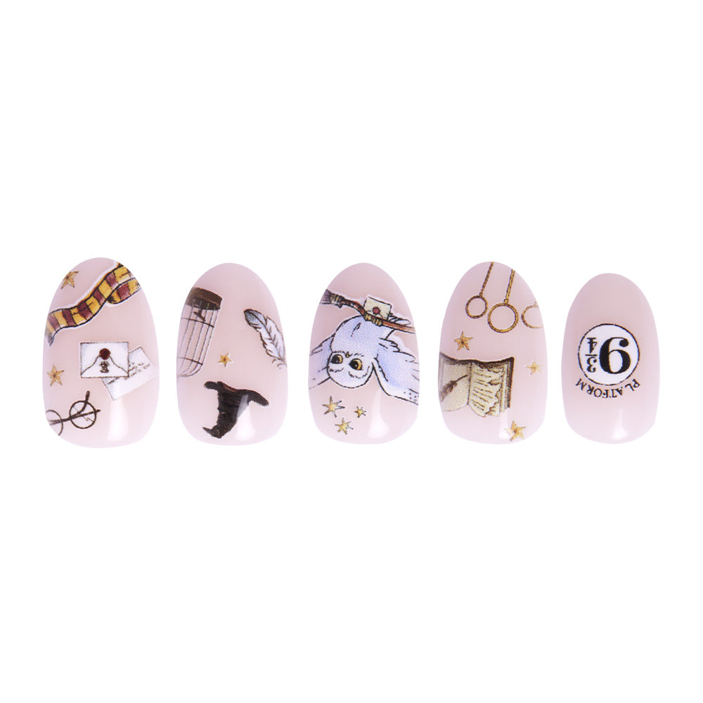Hogwarts™ by glamnetic: Set of five artificial nails, hand-painted with Harry Potter-inspired designs—glasses, scarf, witch hat, feather, Hedwig the owl, Golden Snitch, Hogwarts letters & Platform 9¾—on a pale pink background. - Product image