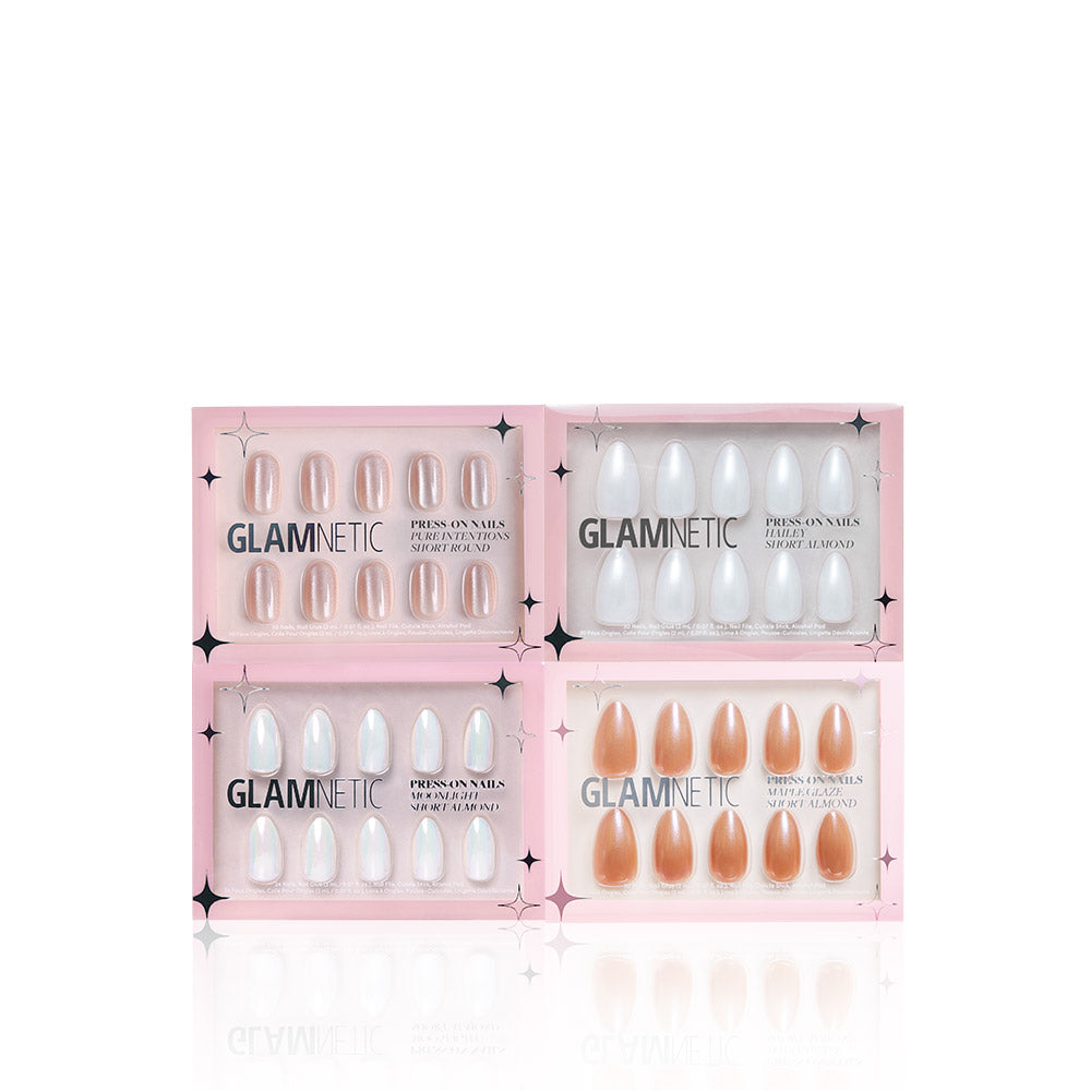 Four boxes of glamnetic’s Glaze It press-on nails in a two-by-two grid, pink packaging with black text. Features nude, white, and mixed tones for versatile manicures, including shades like Maple Glaze and Pure Intentions. - Product image