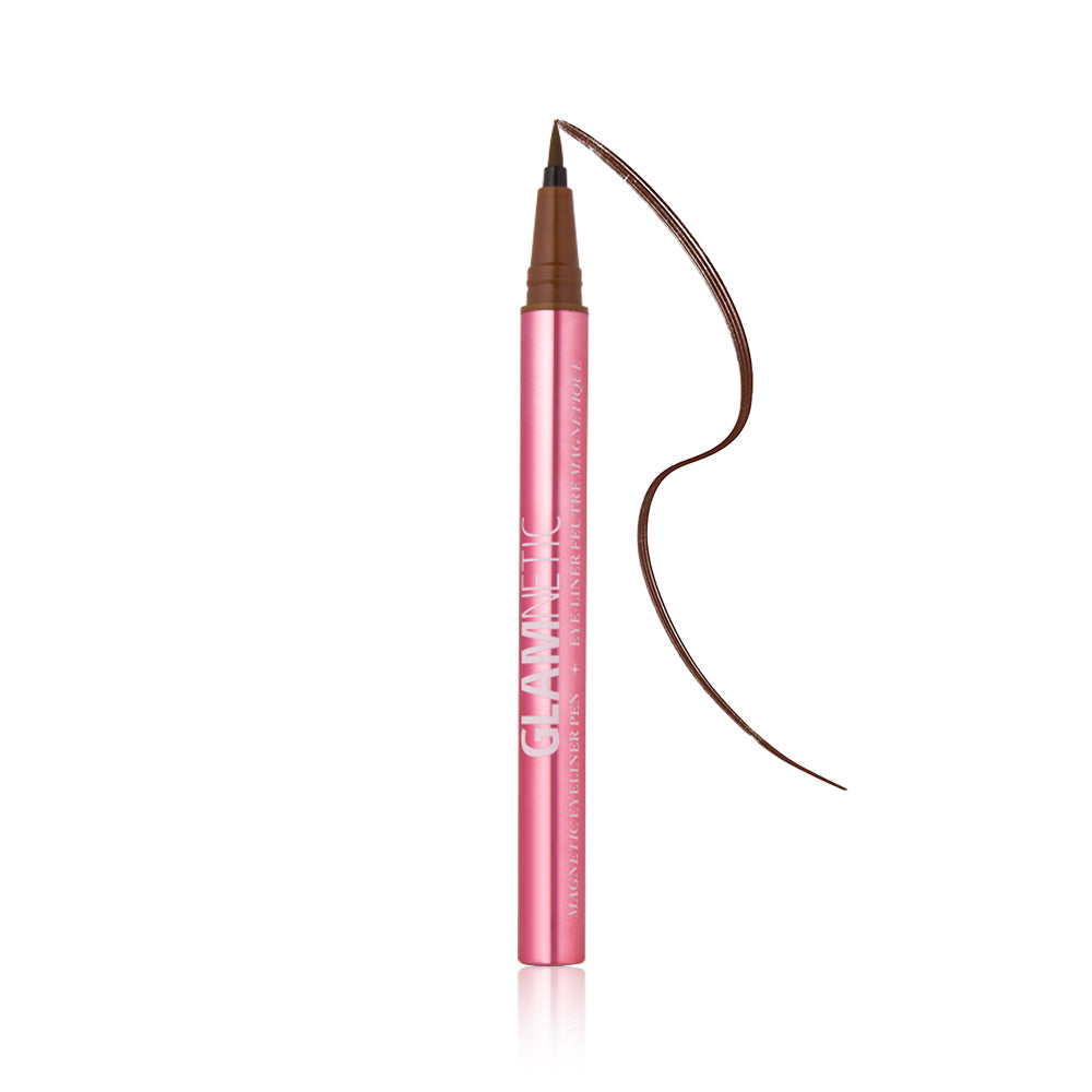 A pink tube of the glamnetic Magnetic Eyeliner Pen with the cap off reveals its felt tip and a curved brown line. The powerful hold formula glides on easily. Set against a white background. - Product image