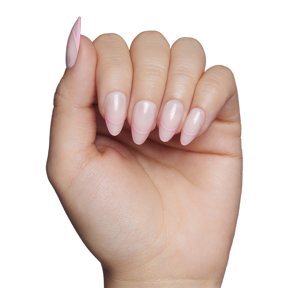 The glamnetic Hot Take nail set features short, almond-shaped tips in a light pink French style with a modern twist—rounded pink tips outlined against a crisp white background. - Product image