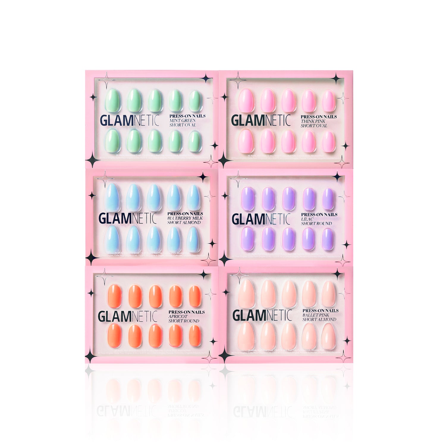 Six packs of glamnetic The Solids: Spring Bloom Collection Press-On Nails, in pastel shades like Ballet Pink, Mint Green, blue, purple, orange, and peach, are shown in pink packaging with black stars on a white background.