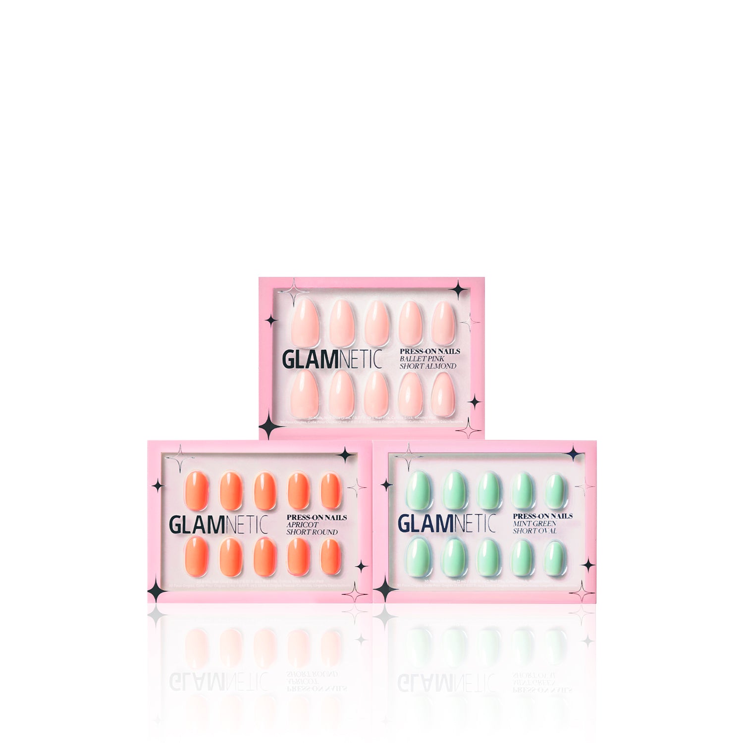 Three glamnetic Springtime Blooms press-on nail boxes are displayed: Ballet Pink on top, Apricot bottom left, and Mint Green bottom right. Each box features a stylish pink design with bold black text. - Product image