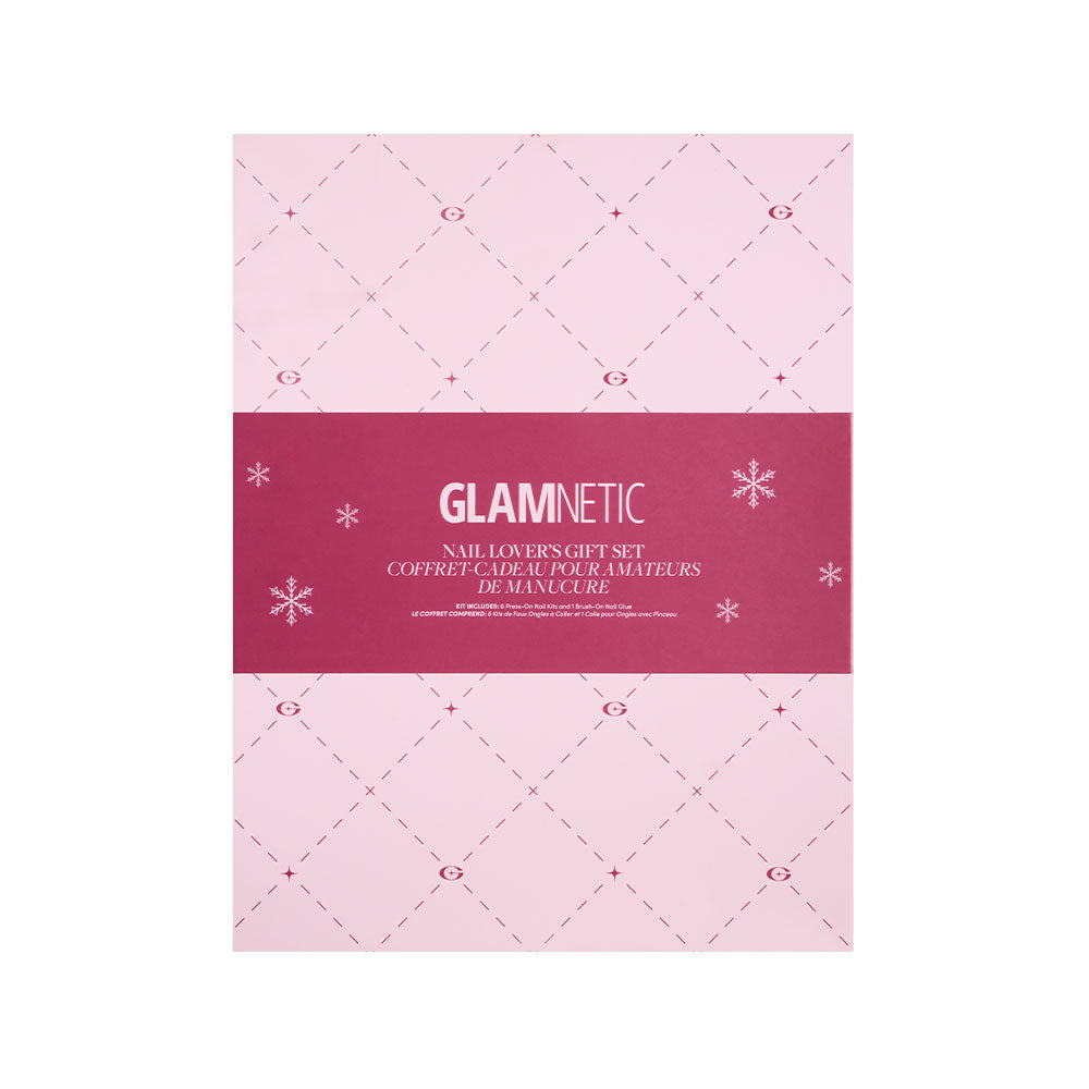A pink box with a diamond pattern, snowflakes, and a bold magenta strip in the center showcases “glamnetic” and “Nail Lover’s Gift Set” in white—perfect for gifting this press-on nails set with long-lasting nail glue. - Product image