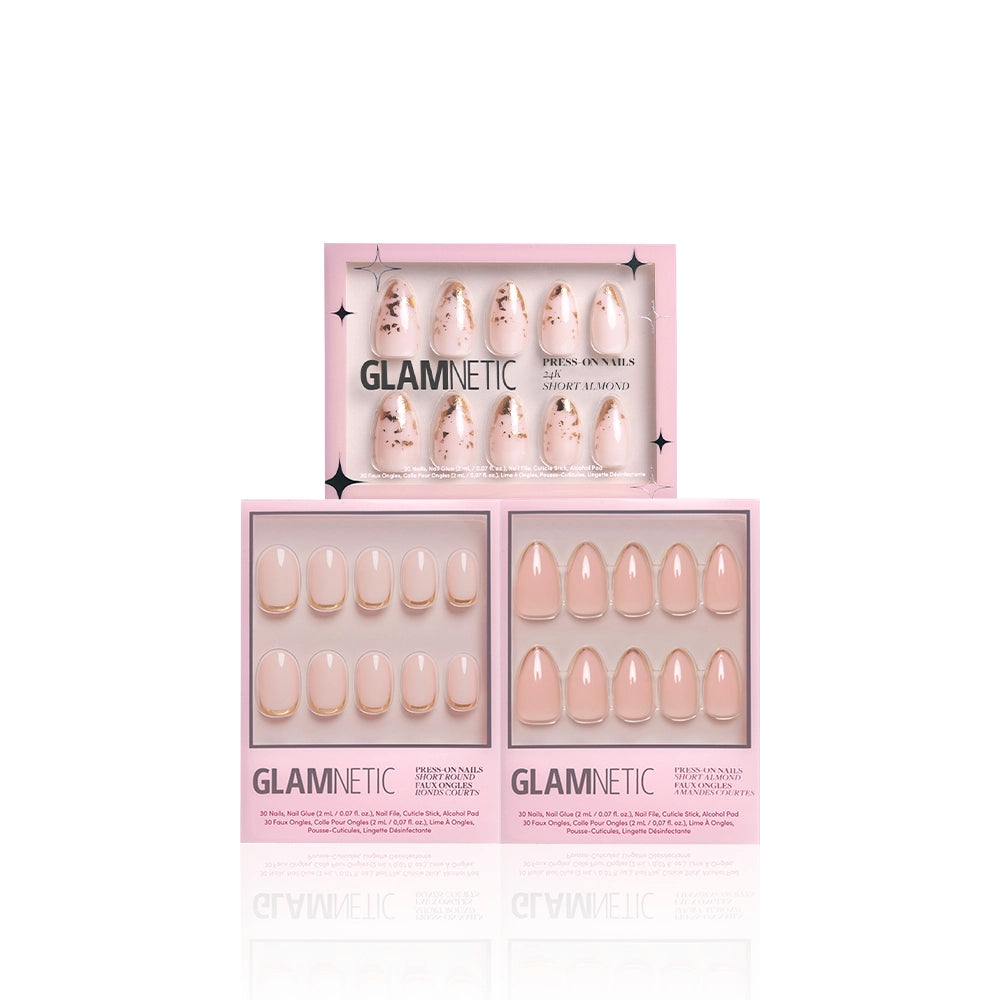 Three boxes of glamnetics Golden Goddess press-on nails are shown. The top has floral and gold foil accents, while the two below display simple nude styles—one with white tips, one with gold tips—all set against a pink background. - Product image