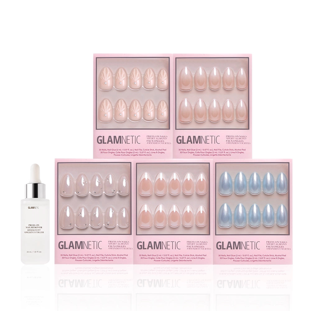 Five sets of glamnetic Anns Bridal Edit press-on nails in pink boxes are arranged in a semicircle around a bottle of glamnetic brush-on nail glue with a white dropper cap, all displayed on a white background. Perfect for bridal or classic French tip looks. - Product image