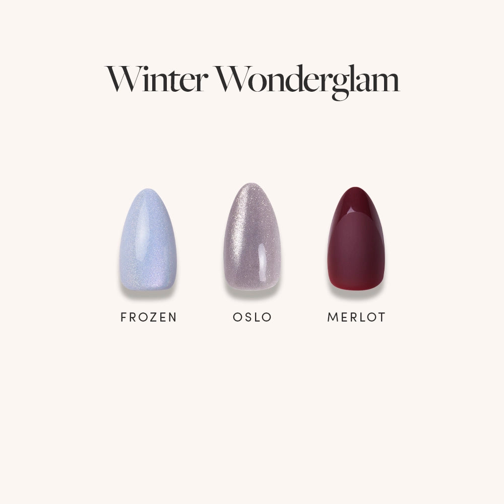 Three glamnetic nail polish swatches—Frozen (shimmery light blue), Oslo (shimmery taupe), and Merlot (deep wine red) with a subtle cat’s-eye finish—are shown under the Winter Wonderglam title against a light background.