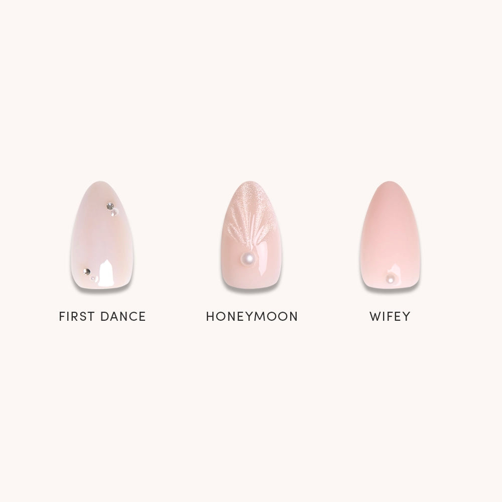 Glamnetic’s Put A Pearl On It press-on nails feature three pink bridal designs: First Dance with rhinestones, Honeymoon with shimmery leaves and 3D pearls, and Wifey with a bead accent—all finished in glossy polish.