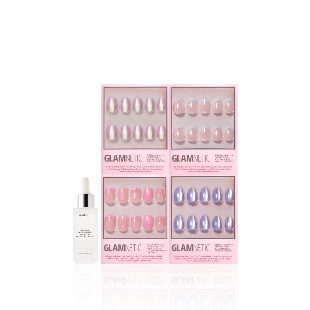 Four boxes of glamnetics Tide & True ocean-inspired press-on nails in pastel and pearlescent pinks and purples—short oval and short squoval shapes—are arranged in a square. A white dropper bottle of glamnetic nail adhesive is on the left. - Product image