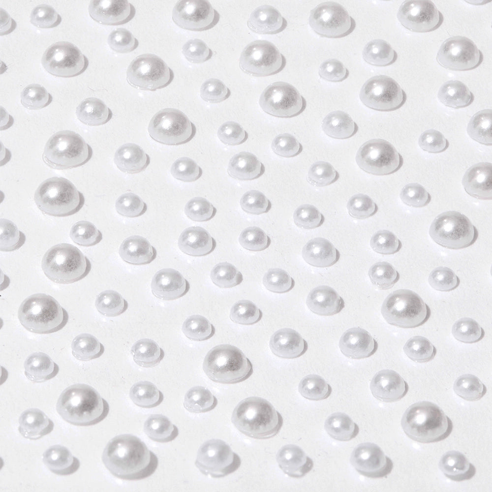 Glamnetics Pearlfect Nail Decal Stickers feature shiny, pearl-like beads of various sizes with a reflective metallic finish, evenly arranged on a flat white surface for an elegant 3D nail art look.
