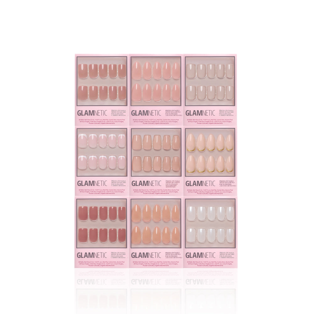 Nine boxes of glamnetic Timeless Tones Collection press-on nails arranged in a 3x3 grid, showcasing elevated neutrals in nude, pink, and beige shades, all in minimalist pink packaging on a white background. - Product image