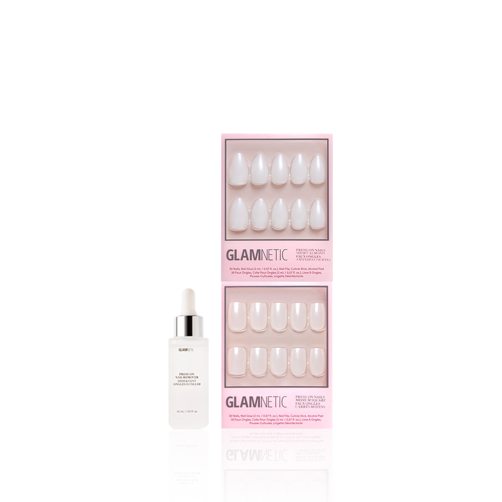 A bottle of glamnetic nail glue stands beside two boxes of glamnetic Bailey + Hailey press-on nails in pink packaging, each showing a set of glossy, neutral glaze Short Almond fit nails. - Product image
