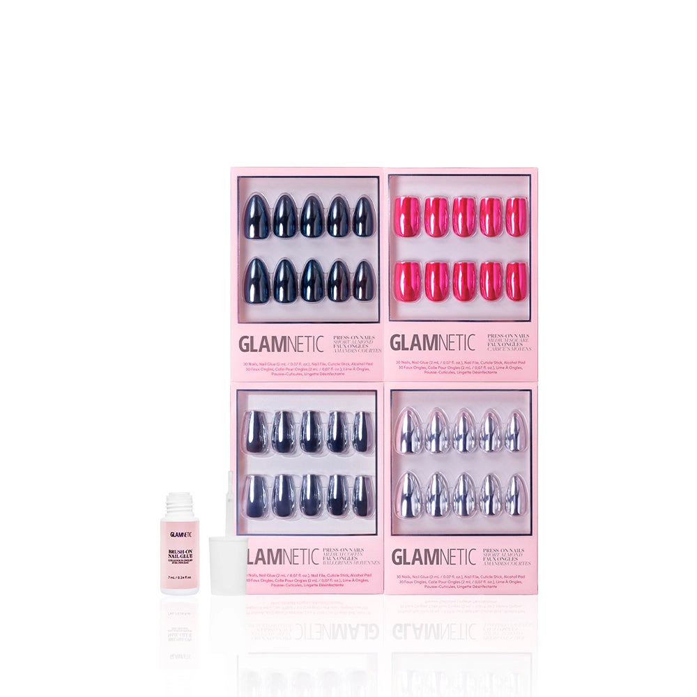Four pink boxes of glamnetic Neon Noir press-on coffin nails—navy, hot pink, metallic blue chrome, and silver—are arranged in a grid with a small bottle of nail glue on the left against a white background. - Product image