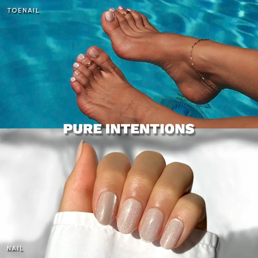 Feet with sheer, glittery nude press-on toenails floating by the pool, shown with matching shimmery nude manicure on short round nails.