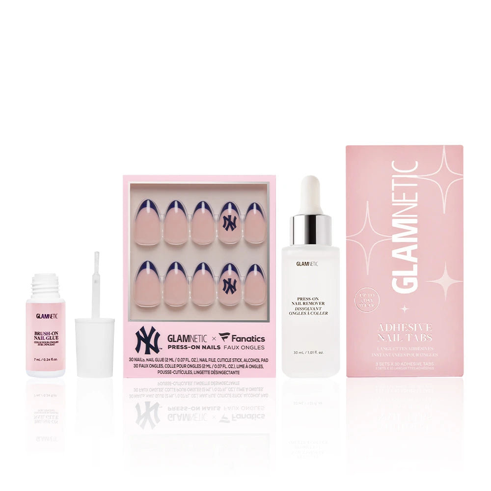 The glamnetic New York Yankees Major League Mani press-on nail set includes adhesive tabs, nail glue, and cuticle oil, shown on a white background with pink and white packaging.