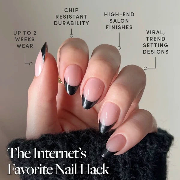 Caviar - A hand with short almond Glamnetic Caviar press-on nails featuring a black French manicure, highlighting chip-resistant durability, salon finishes, and long wear.