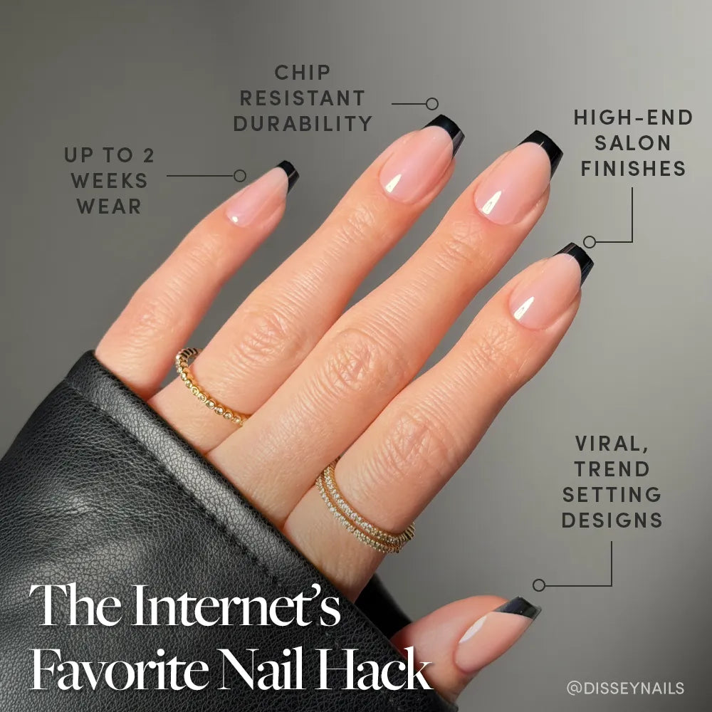 A hand shows well-groomed nails with coffin-shaped black French tips and gold rings, wearing glamnetic's Balsamic Glaze. Text highlights: “up to 2 weeks wear,” “chip resistant durability,” “high-end salon finishes,” and “viral, trendsetting designs.”. - Product image