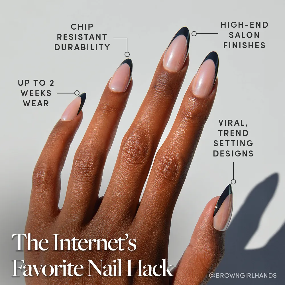A hand with long, almond-shaped nails features a minimalist black tip design inspired by glamnetic Black Truffle Press-On Nails—chip-resistant, high-end finish, trendy viral style, and up to 2 weeks of durable wear. - Product image