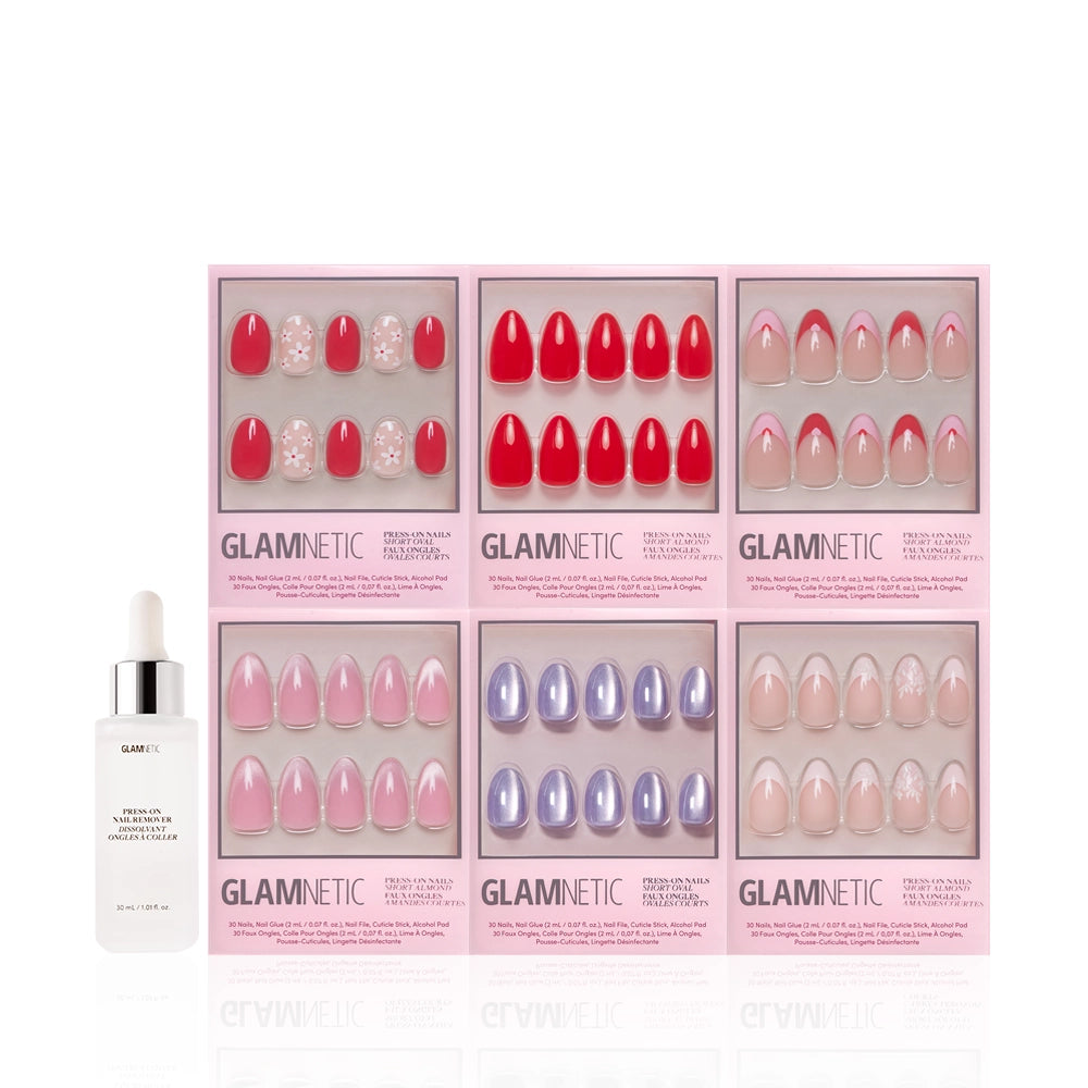 The glamnetic Romantic Resolutions set includes six salon-quality press-on nails in pink, red, purple, and nude designs in pink packaging, plus a dropper bottle of glamnetic nourishing cuticle oil in front. - Product image
