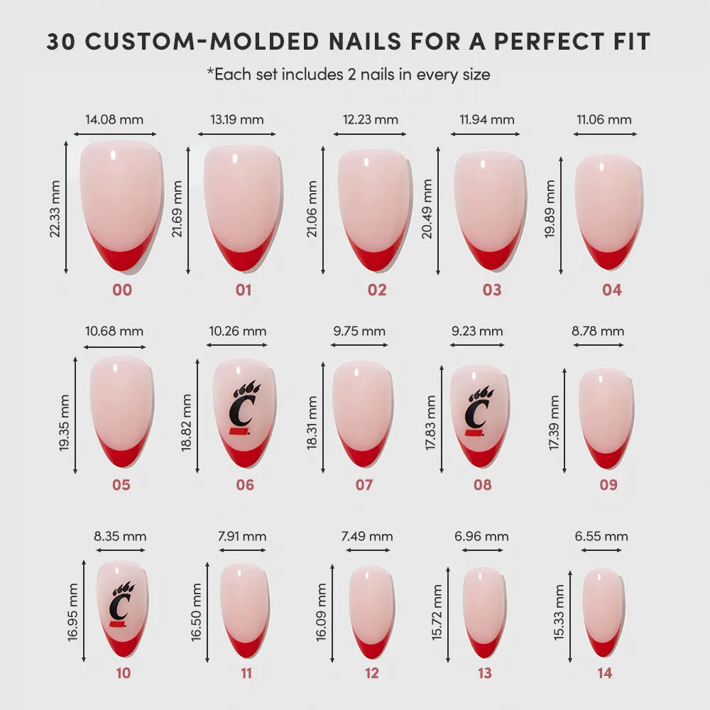 The glamnetic Cincinnati Bearcats Press-On Nail Set includes 15 salon-quality sizes (dimensions in mm), 2 nails per size. Pink with red tips; some feature a paw print and the letter C, inspired by the Bearcats design. - Product image