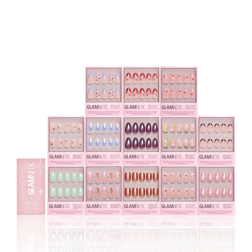 A pyramid display of glamnetic’s The Juicy Drop Collection shows off colorful, glossy almond press-on nails in pink boxes with the glamnetic logo on the front. - Product image