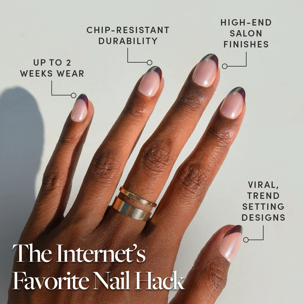 A hand with a modern, minimalist manicure featuring glamnetic Cherry Mood press-on nails in a short oval shape with nude base and green and purple tips. Up to 2 weeks wear, chip-resistant, salon finish, inspired by viral trends. - Product image