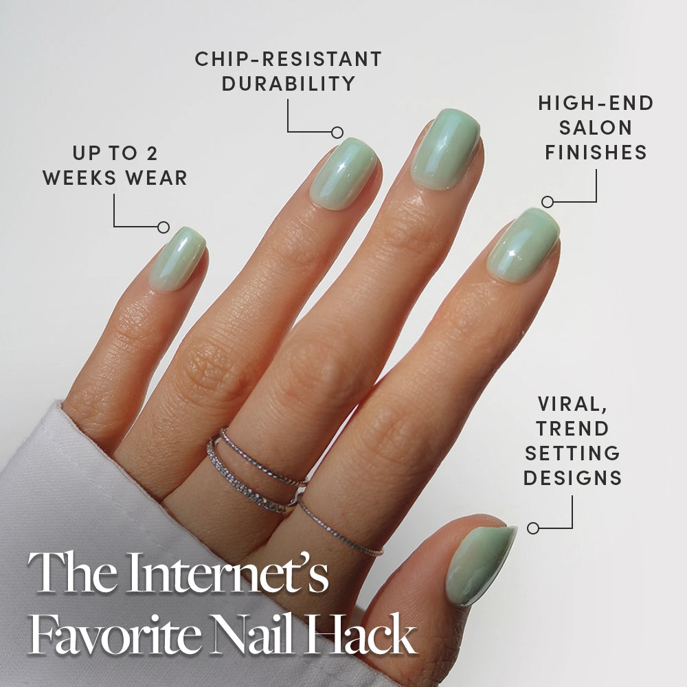 A hand with glamnetic’s Honeydewy mint green press-on nails and three thin rings is shown. Labels highlight up to 2 weeks wear, chip-resistant durability, salon finishes, and trendy designs. Text: The Internet’s Favorite Vegan Cruelty-Free Nail Hack. - Product image