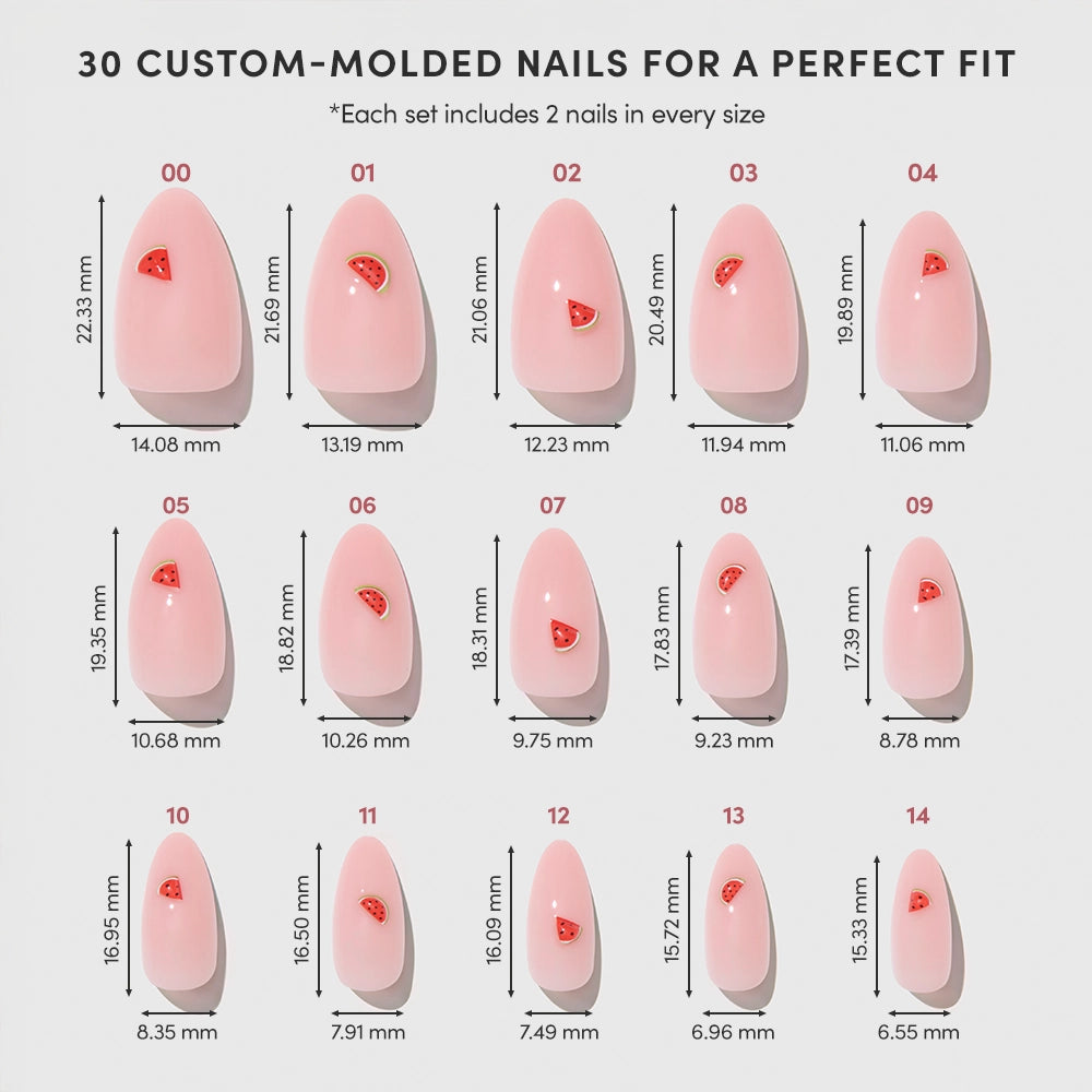 Juicy Slice by glamnetic features 15 sizes of glossy pink press-on nails with small red hearts, displayed in rows with measurements below each nail. Each set includes 30 almond-shaped nails to ensure a perfect fit. - Product image