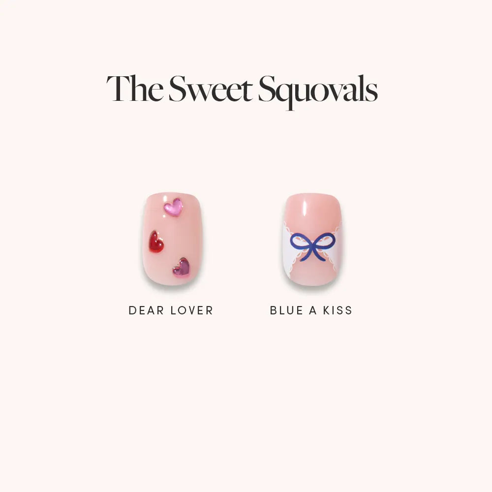 Two artificial nails from glamnetic’s The Sweet Squovals: one with a pink base and Dear Lover heart art, the other with a light blue Blue A Kiss ribbon design. Ideal for everyday glam.