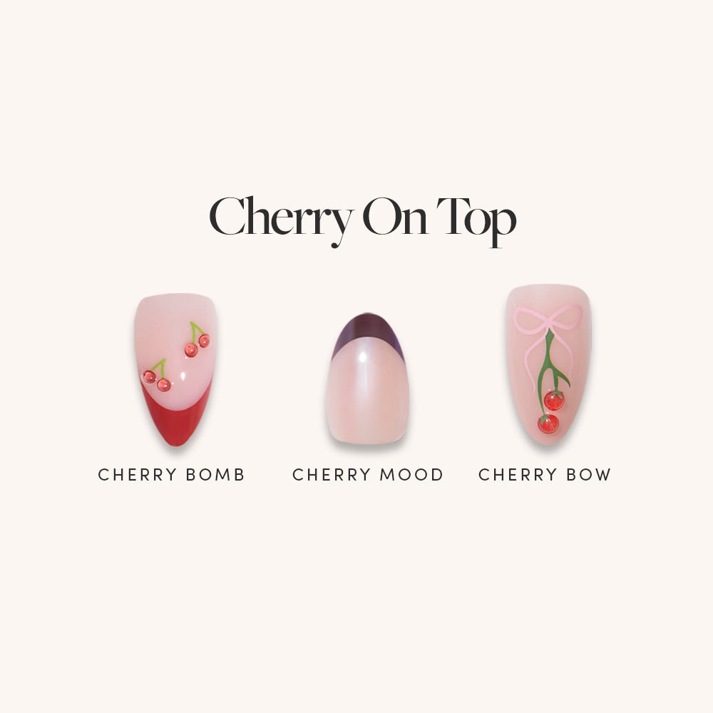 Three cherry nail designs in glamnetic’s Cherry On Top set: classic French with tiny cherries, dark red crescent tips, and pink bows with cherries—a perfect almond nail set.