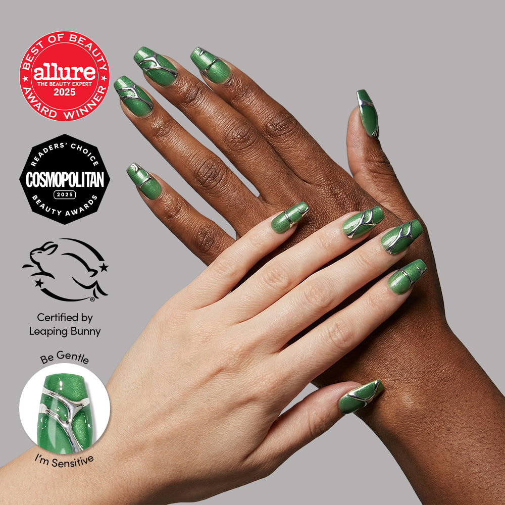 Two hands with green, white-striped coffin nails in glamnetic's Salazar Slytherin™ set overlap on gray. Allure and Cosmopolitan award badges, the Leaping Bunny cruelty-free logo, and a close-up of Be Gentle, Im Sensitive nail are shown.