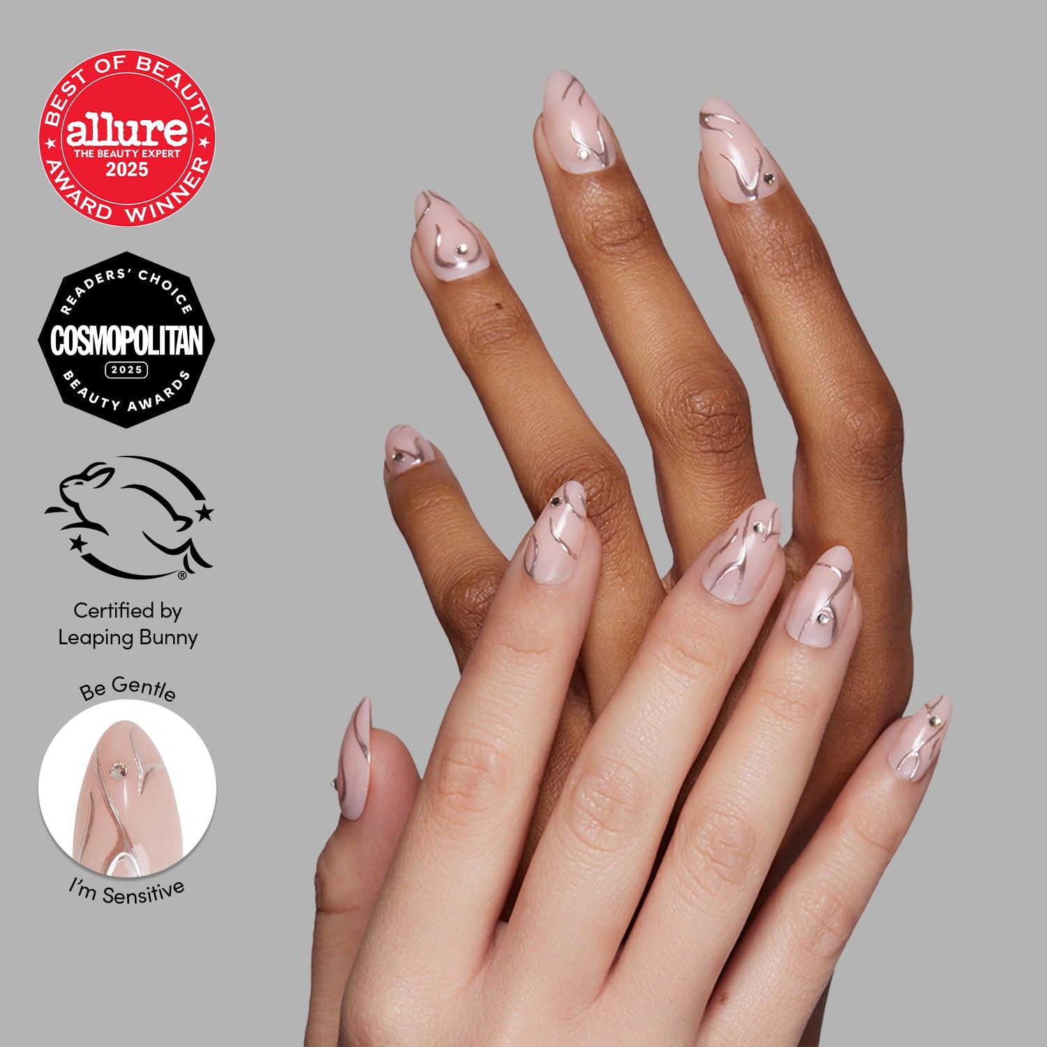 Two hands with manicured, short almond nails in pink polish and abstract line art. Beauty award badges, cruelty-free logos, and a "glamnetic Astro" label appear on the left side of the image.