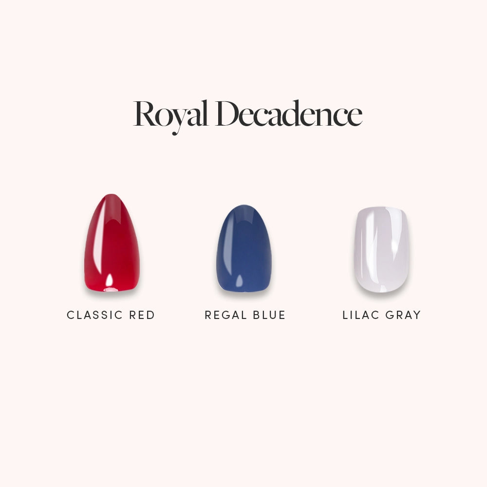 Under the heading "Royal Decadence" by glamnetic, three reusable short press-on nails in Classic Red, Regal Blue, and Lilac Gray are displayed on a pale background—perfect for effortless style.