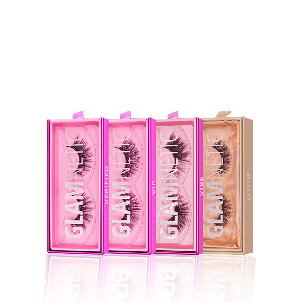 Four pairs of thick, voluminous glamnetic Butterfly Effect lashes are displayed upright in three pink and one peach box—this lash bundle is perfect for achieving bold spring lashes.