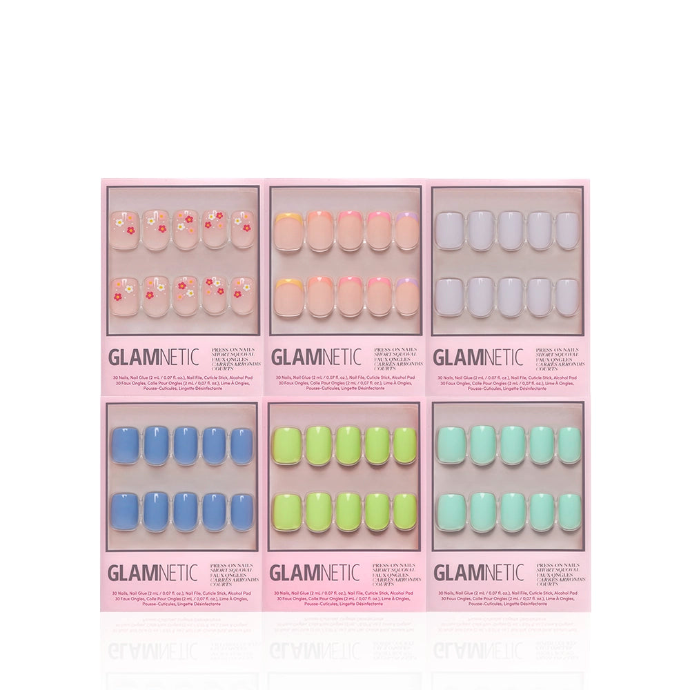 Six boxes of glamnetic Squoval Season press-on nails in a pastel bundle, featuring floral designs and peach, pink, white, blue, green, and mint shades displayed in two rows on a white background. - Product image