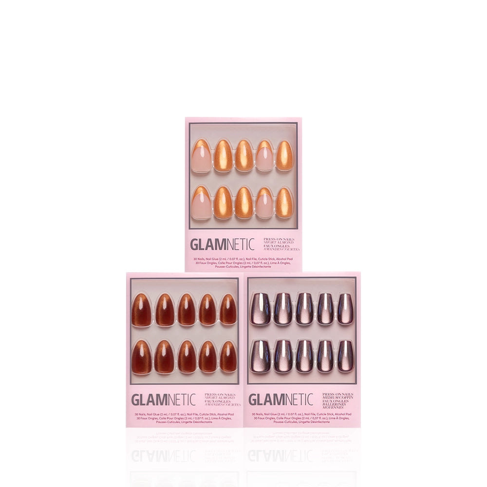 Three boxes of glamnetic La Vida Velvet press-on nails are shown. Each almond set has ten nails in metallic gold, deep reddish-brown, and black with silver tips, displayed on a white background for dimensional shimmer. - Product image