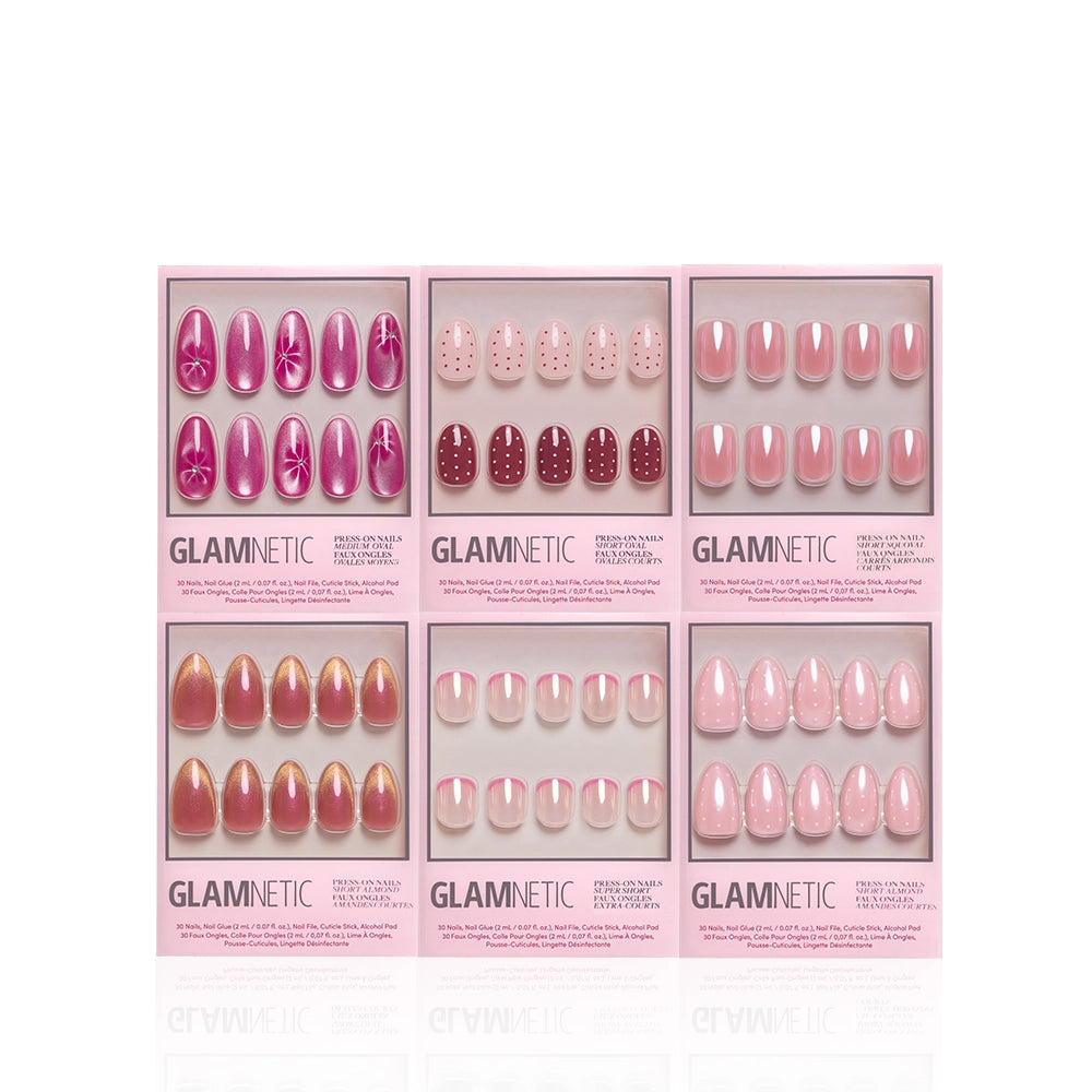 Blush Dusted by glamnetic features six pink-themed press-on nail sets—including floral, polka dot, ombre, and glazed finishes—arranged in two rows of three in a pink glamnetic box. - Product image