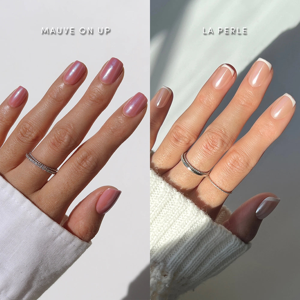 Two hands showcase glamnetic's Squoval Society nails: the left hand sports glossy mauve-pink (Mauve On Up) while the right shows sheer polish with white French tips (La Perle). Both wear rings and white sleeves.