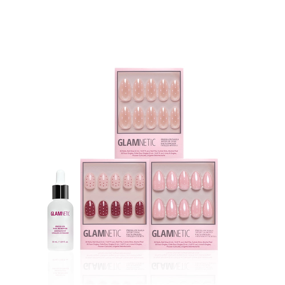 Three sets of glamnetic Polka Pop artificial nails in pink packaging, with almond and polka dot styles in pink and red designs, plus a bottle of glamnetic cuticle oil with dropper. All items are shown on a white background. - Product image
