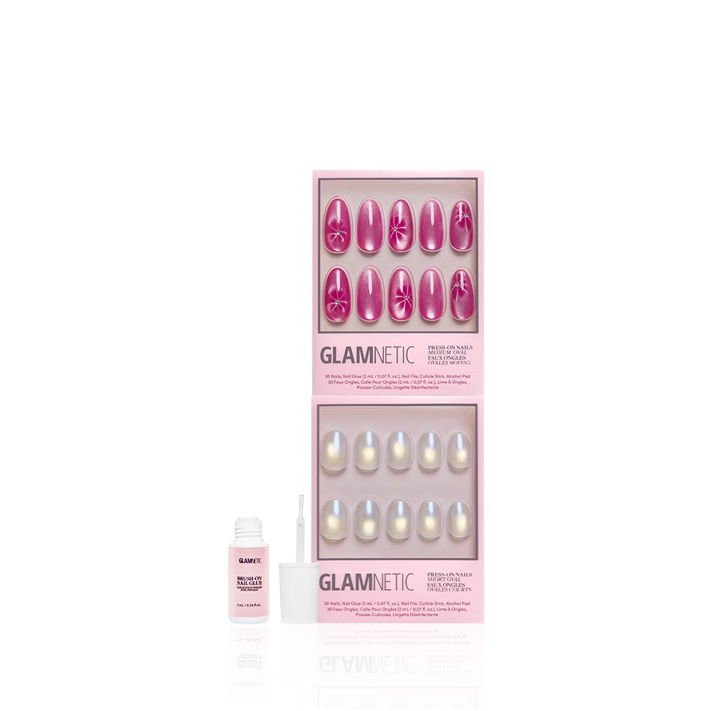 Two sets of glamnetic Siren Sisters press-on nails in pink packaging—one with rose velvet pink floral designs, the other with an iridescent chrome finish—are displayed alongside a small open nail glue bottle and brush applicator. - Product image