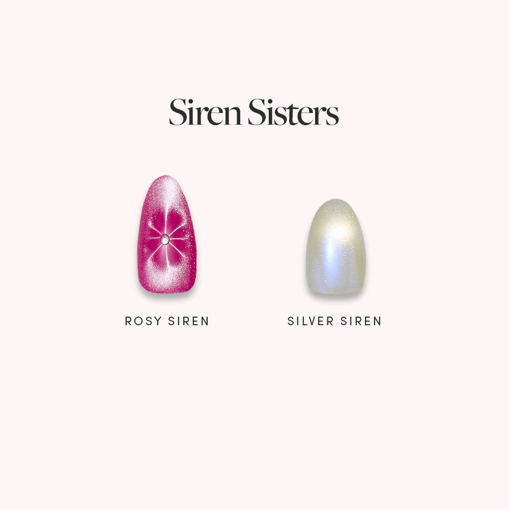 Two artificial nails from glamnetic's Siren Sisters set are shown: the left, Rosy Siren, has rose velvet with a white starburst and gem; the right, Silver Siren, is chrome with an iridescent sheen. Text reads "Siren Sisters.