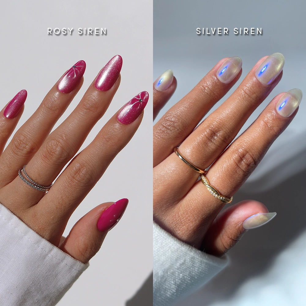 Two hands showcase “Siren Sisters” nails by glamnetic: the left with long, shimmery pink rose velvet and white designs, the right with short oval iridescent chrome. Both hands are adorned with rings.