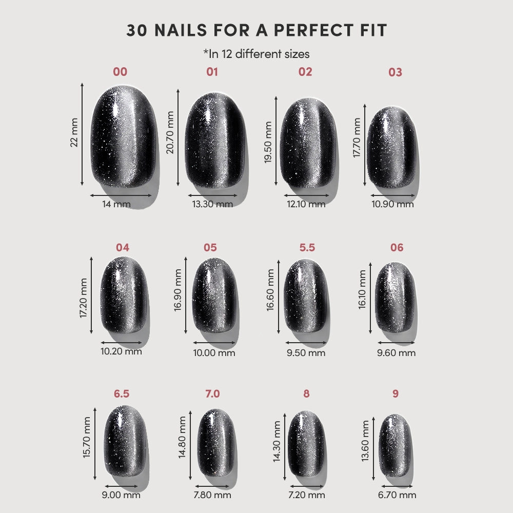 A size chart for glamnetic's Galactic press-on nails displays 12 sizes (00–9, including half sizes) with length and width in mm. Each black nail has white speckles—perfect for customizing your vegan manicure. - Product image