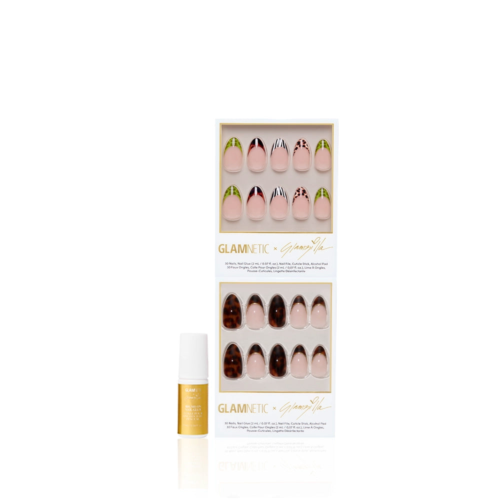The FOREVER FIERCE almond press-on nails by glamnetic feature pink and brown designs, including green-tipped and tortoiseshell animal prints, displayed in a box with a small gold and white nail glue bottle in front. - Product image