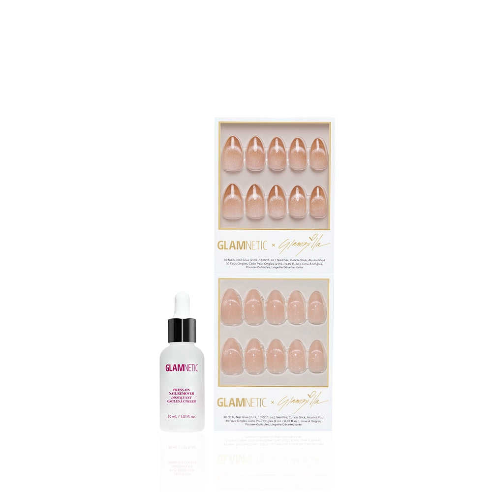The glamnetic OUI OUI VELVET set features nude short almond press-on nails with a velvet finish in two trays, plus a bottle of nail glue with dropper, all showcased against a white background. - Product image