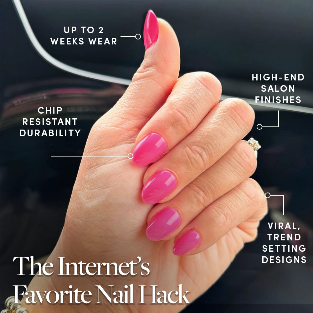 A close-up of a hand with glossy Hot Pink, short oval press-on nails by glamnetic. Enjoy up to 2 weeks’ chip-resistant wear, salon-quality finish, and trendy summer designs—The Internet’s Favorite Nail Hack. - Product image