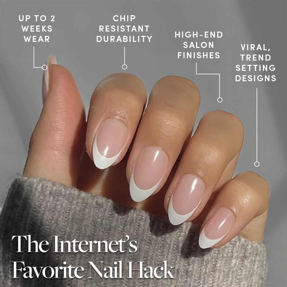 A hand with almond-shaped, french tip Ma Damn press-on nails by glamnetic is held against a neutral backdrop. Text touts long wear, chip resistance, salon finish, trendsetting designs—making them The Internet’s Favorite Nail Hack. - Product image